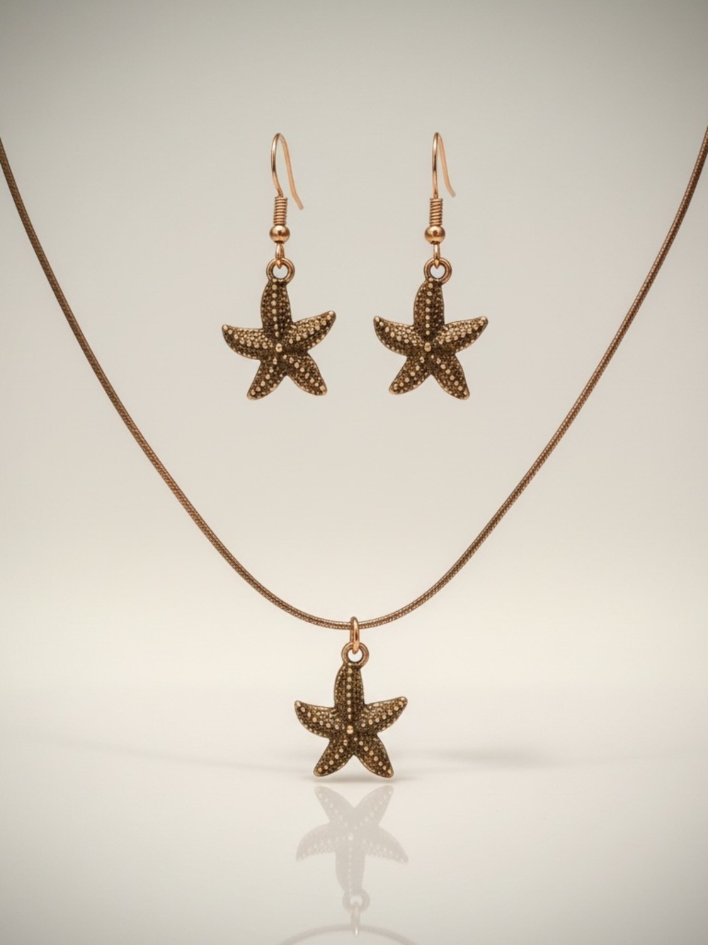 Handcrafted orange brown copper starfish earrings & leather‎ necklace set